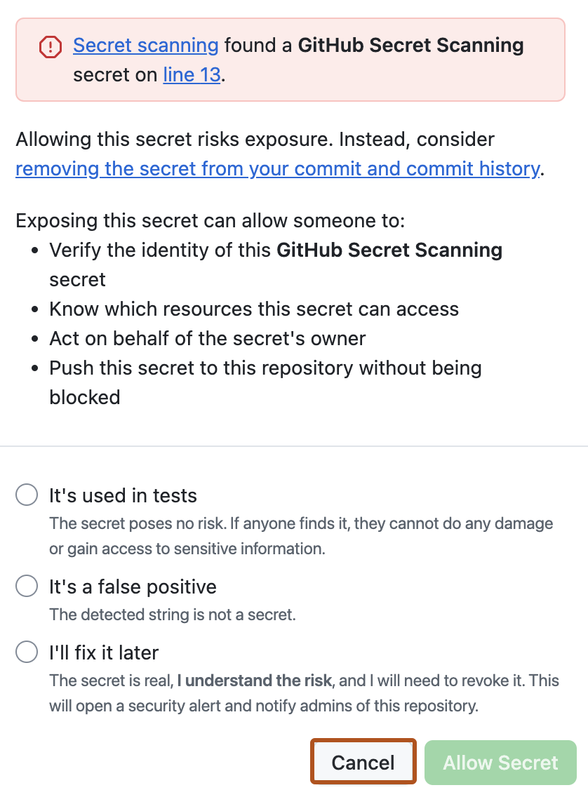コミットしようとしたファイルの 13 行目に関するプッシュ保護アラートのスクリーンショット。 [Cancel] ボタンがオレンジ色の枠線で強調されています。